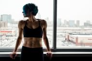 Heel touches primarily targets the oblique muscles aka the side abs. (Photo via Pexels/Karl Solano)